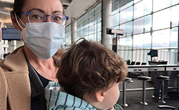 mom and baby daughter at airport during covid