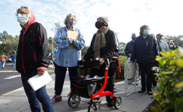 people waiting in line for vaccine