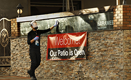 outdoor dining employee washing window