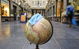 surgical mask on a globe