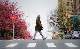 masked man walking